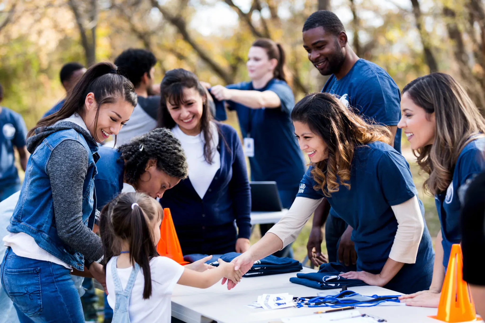 Volunteers and city staff helping residents sign up at a community event