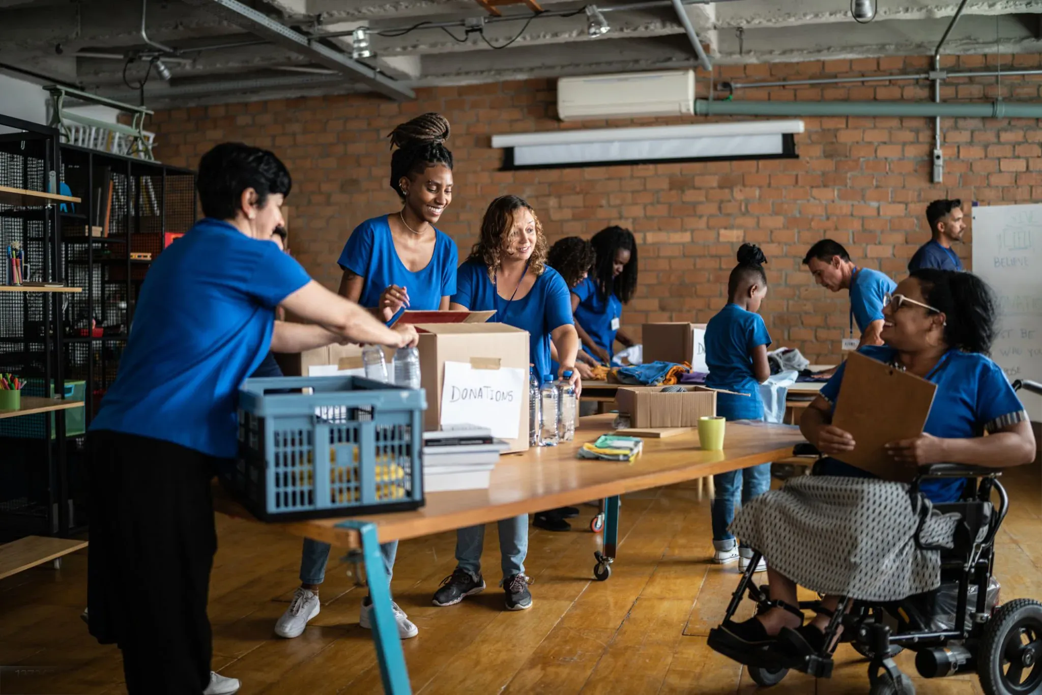Volunteers preparing donation boxes at a community organization
